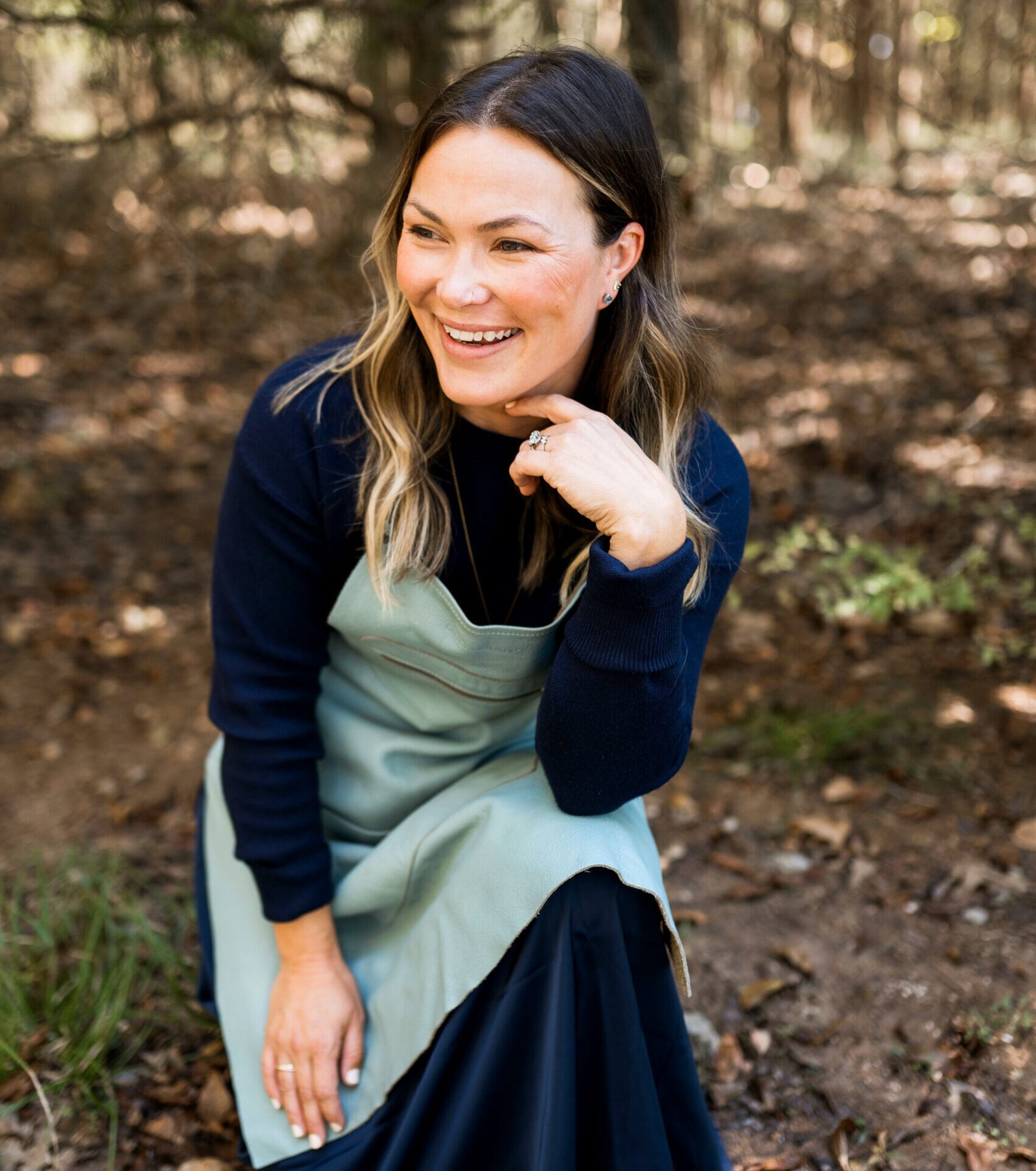 Holly Headshot woods on knee